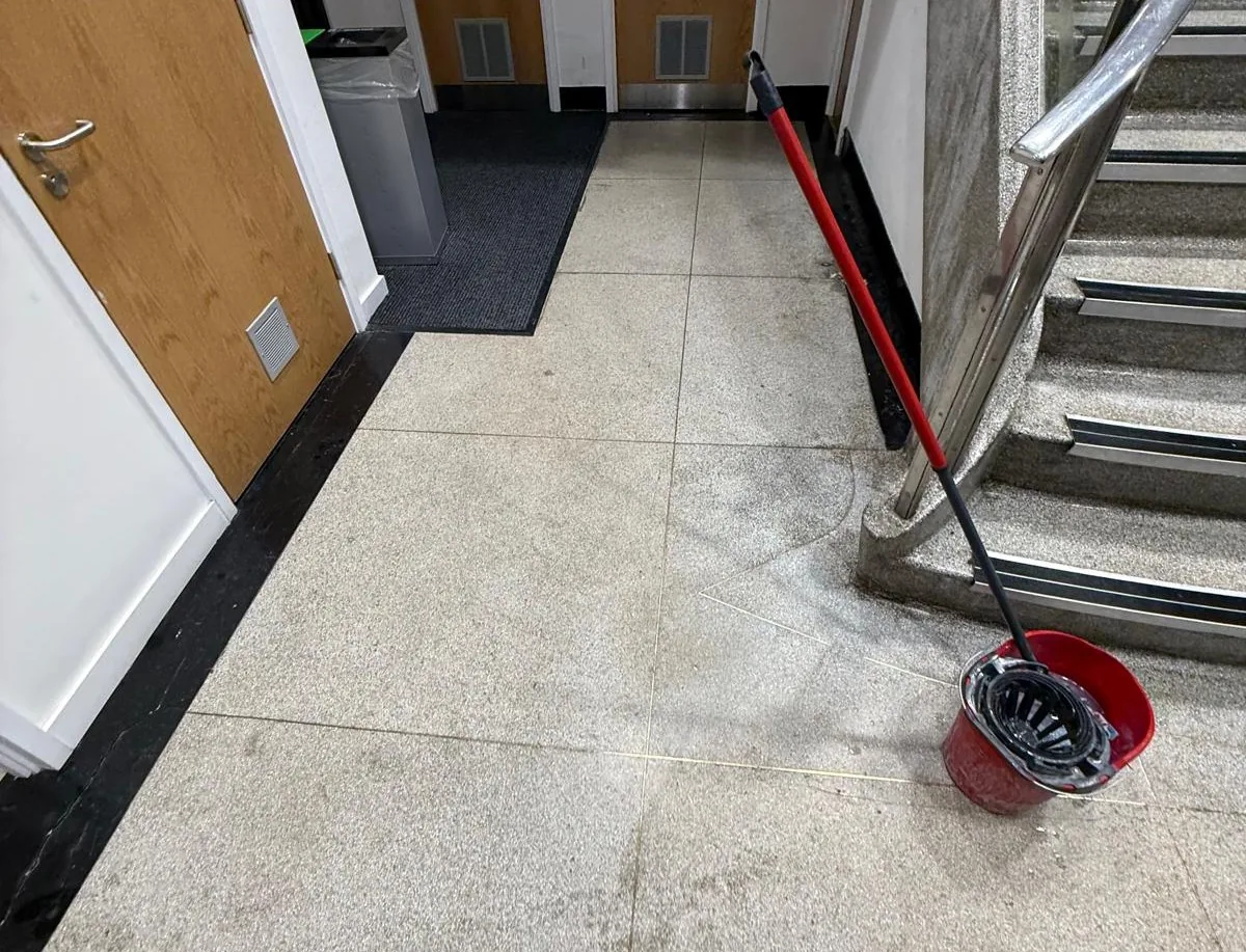 Worn terrazzo floor and surface marking before treatment at St Mary’s Hospital