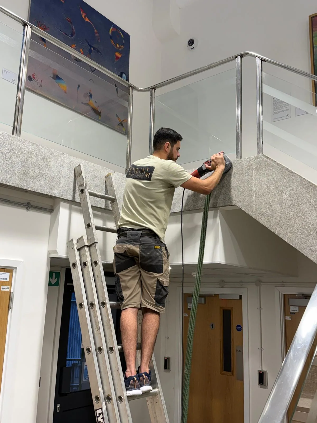 Detailed edge grinding around the upper landing at St Mary’s Hospital