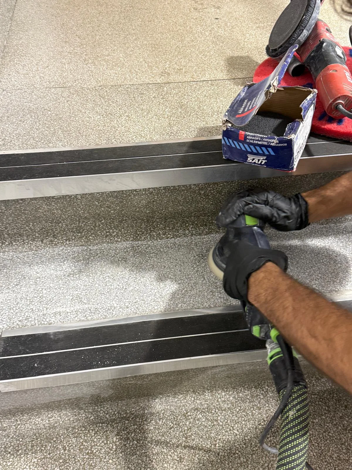 Detailed polishing of terrazzo stair treads and edges at St Mary’s Hospital