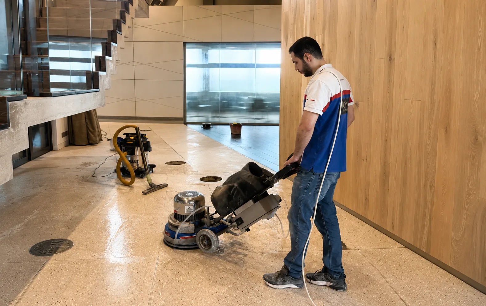Cleaning the polished lobby floor
